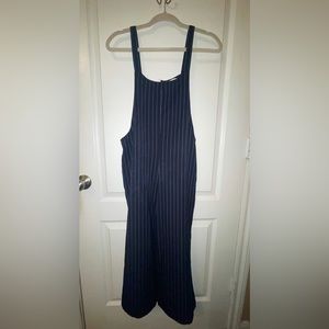 Adorable navy blue jumpsuit with white stripes down it!